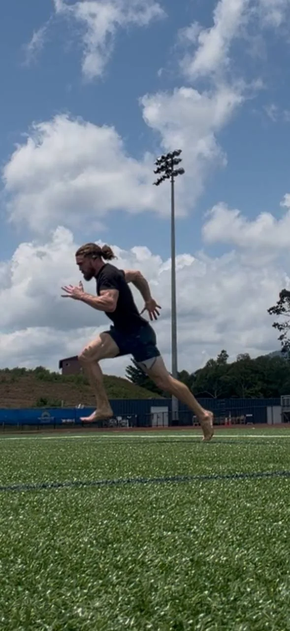 Dakota Hall sprinting on an outdoor field